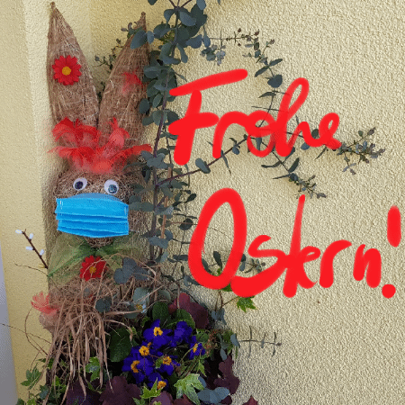 Osterhase mit Mundschutz und Text "Frohe Ostern!"